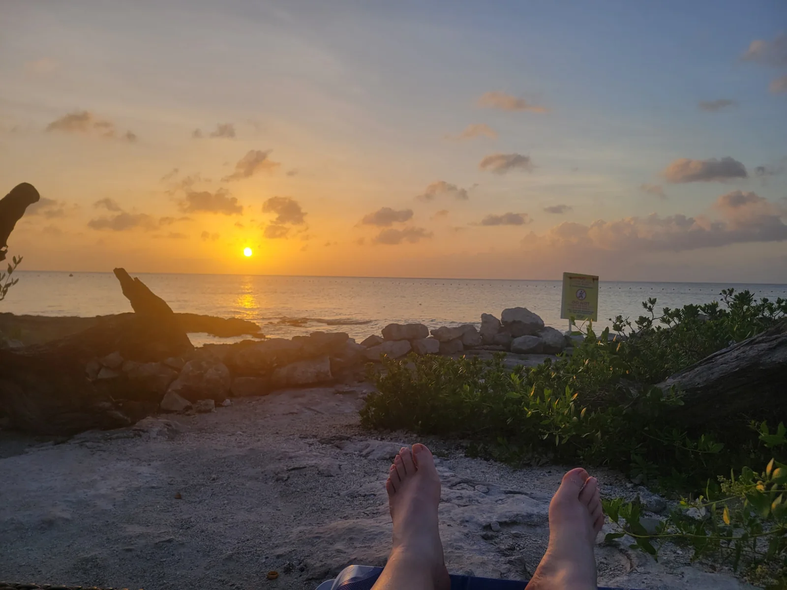 Sunset over the Caribbean from the rocky shoreline of Cozumel, Mexico
